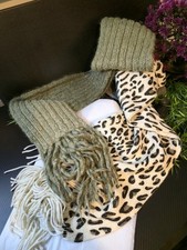 TWO BEAUTIFUL DESIGNED SCARVES BOTH WITH TASSLES.