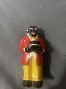 Made In The Usa, Black Man Holding A Hat In A Red Suit With Yellow Pants