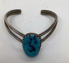 Sterling silver cuff bracelet with a turquoise center srone. excellent condition