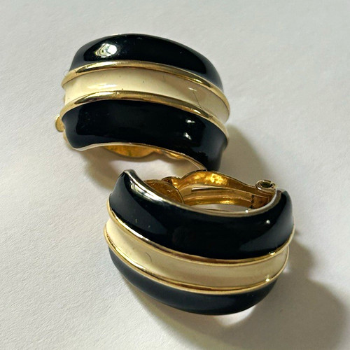 St. John gold-tone and black enamel clip-on earrings with a vintage design.