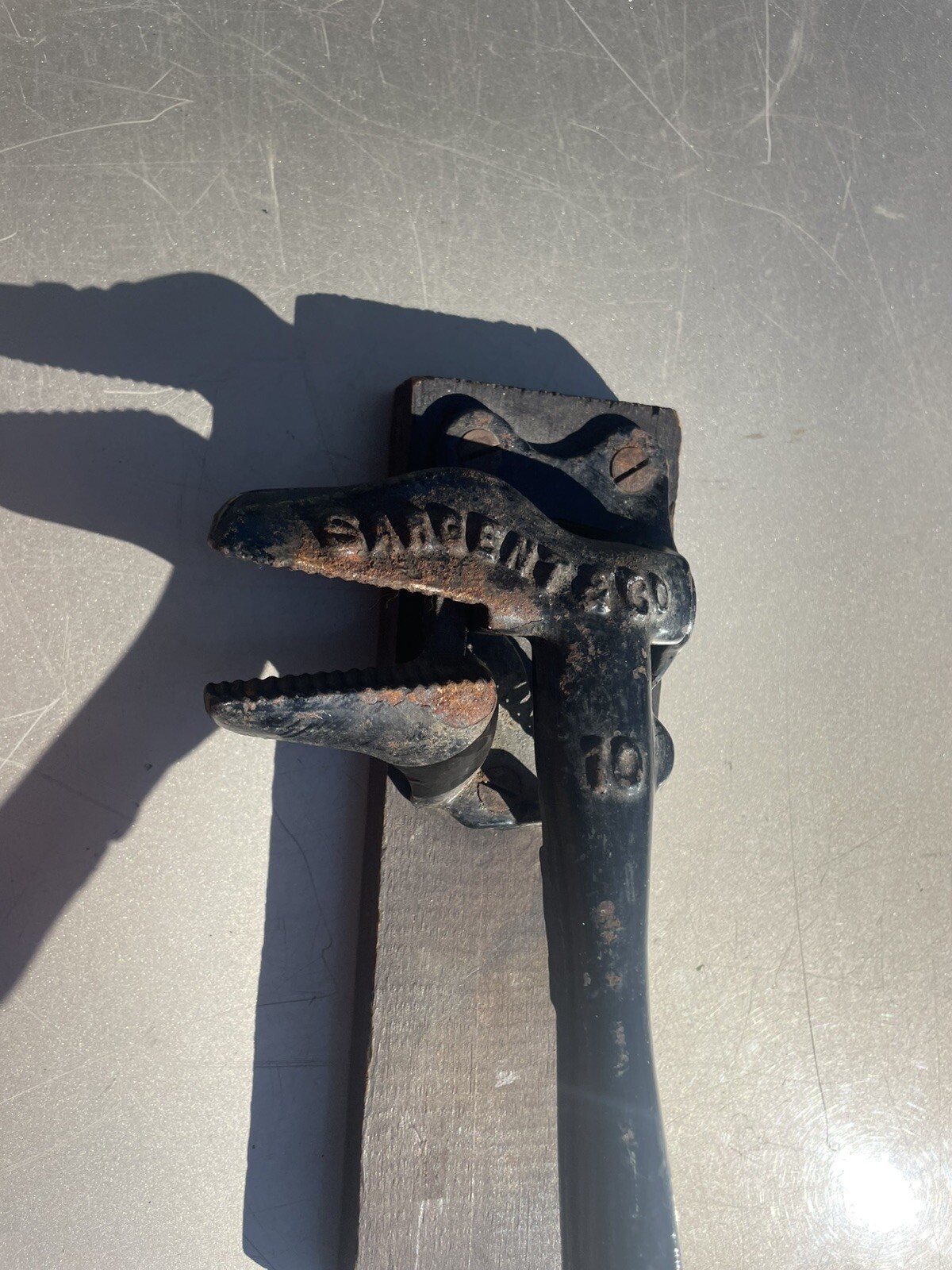 ANTIQUE CAST IRON SARGENT & CO. NO. 10 BRAND NUTCRACKER ATTACHED TO WOODEN BOARD