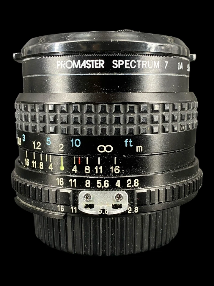 Lente vintage RMC Tokina 28 mm 1:2,8 Japón con filtro Promaster Spectrum #7 en muy buen estado+ Foto 2 de 4