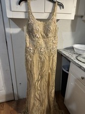 gold-colored formal evening gown or prom dress