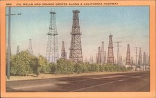 Los Angeles California Oil wells and orange groves along a california highway
