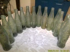 COLLECTION OF 14 VINTAGE EMPTY COCA-COLA BOTLLES EMBROSSED PATTERNS 10 OZ