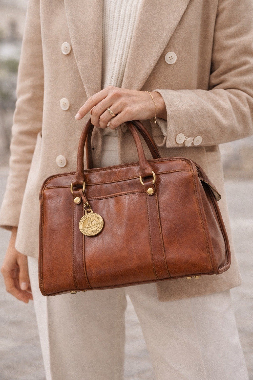 Brown pebbled leather structured satchel handbag by Brahmin with brass hardware