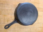 The Merit #7 cast iron skillet is a vintage, quality pan produced  By GRISWOLD