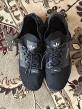adidas NMD_R1 Primeknit STLT Triple Black for Sale | Authenticity  Guaranteed | eBay