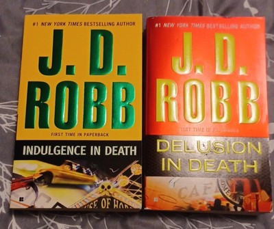 Two J. D. Robb books, Indulgence in Death & Delusion in Death
