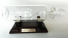 Ship In A bottle 16th Century Galleon On Wooden Stand 21cm Long