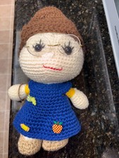 Amigurumi crochet doll with school theme clothing and pins