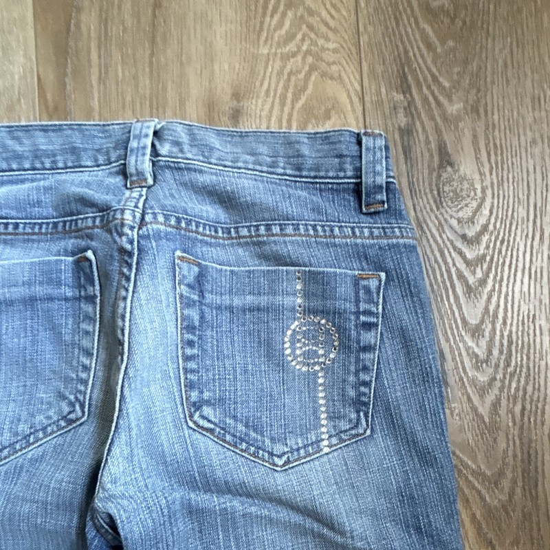 Bebe vintage straight leg jeans. Striated design with a bedazzled B on the back.