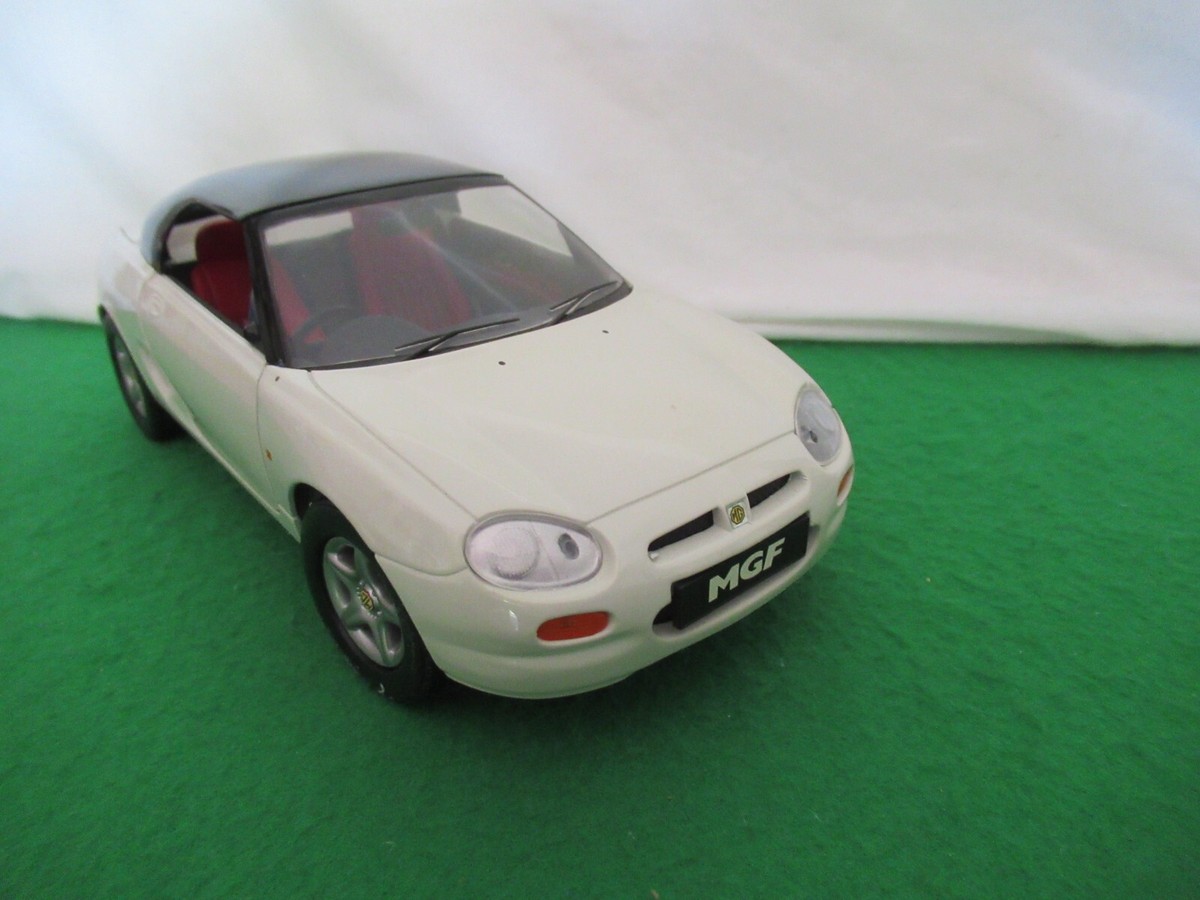 A boxed Corgi 1:18 Scale MGF and a boxed Donnington 1:18 Scale MGF. (R10