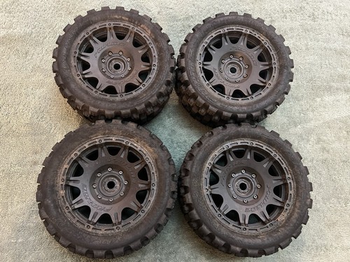 Pro-Line Badlands MX57 Tires on Black Raid 24mm Hex Wheels Traxxas X-Maxx XRT