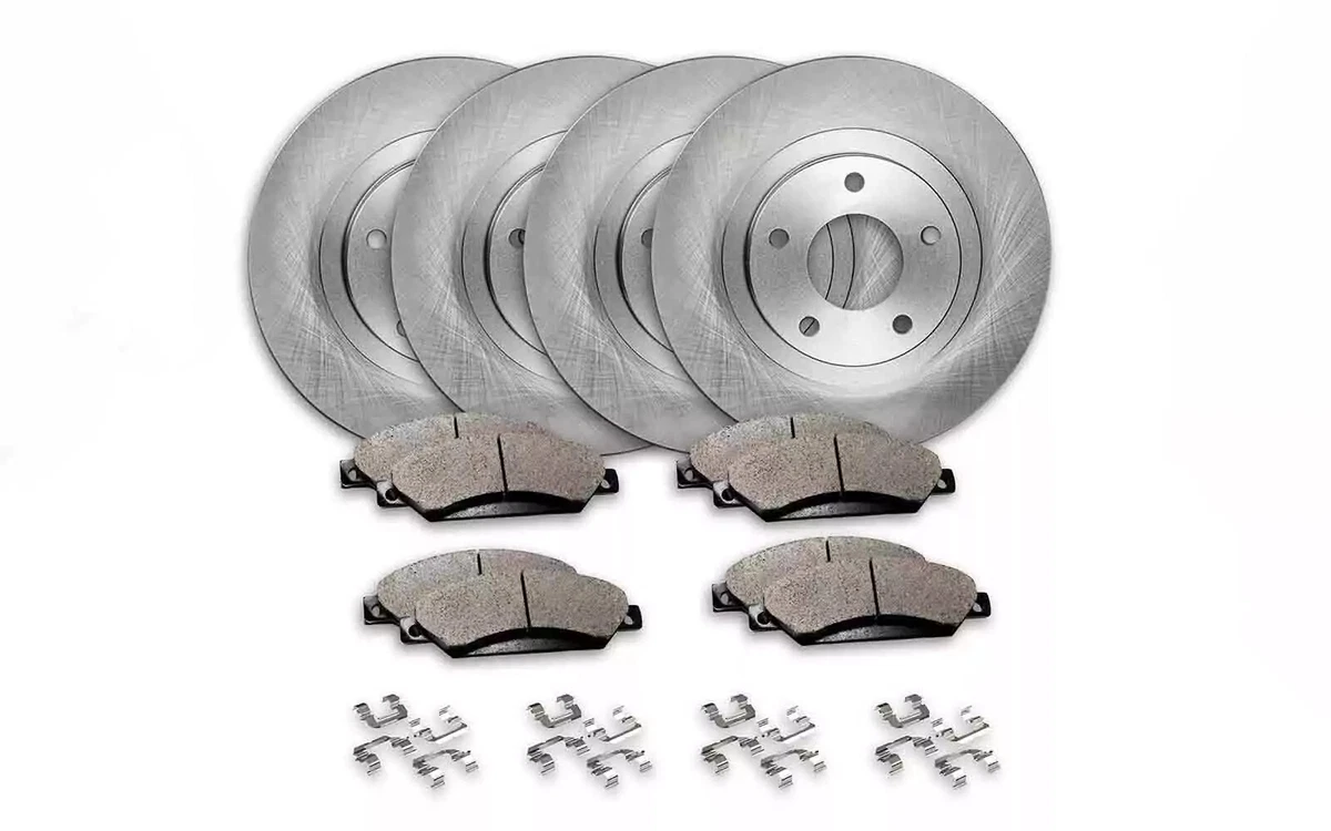 A set of four solid brake rotors, brake pads, and clips for a Toyota RAV4.
