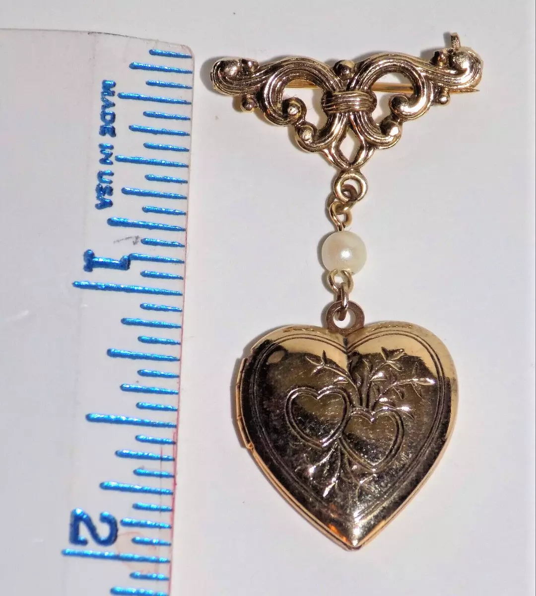Locket pin best sale brooch