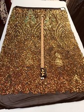 ORANGE IRIDESCENT SEQUINS ON A 4 STRETCH BLACK MESH-PROM-BY YARD.