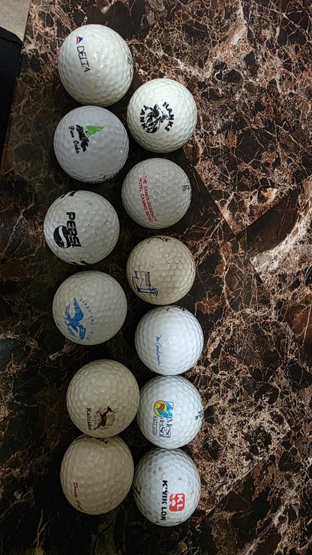 lot of 12 golf balls with logos