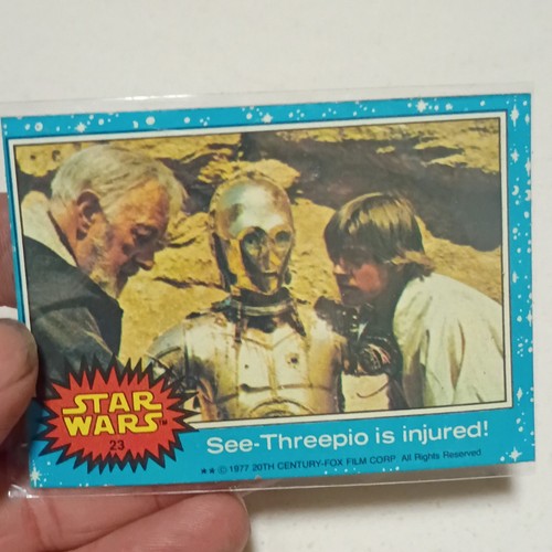 1977 Topps Star Wars #23 See-Threepio is injured! — Raw