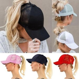 messy bun with baseball cap