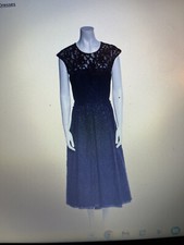 Elegant Tea Length Dress With Sequin Detail At Chest.