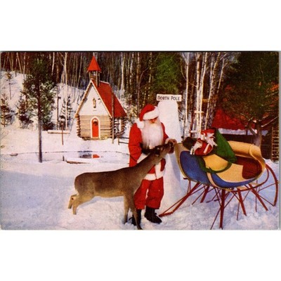 Santa Feeds A Native Deer As He Packs His Sleigh Vintage Postcard SPZ27