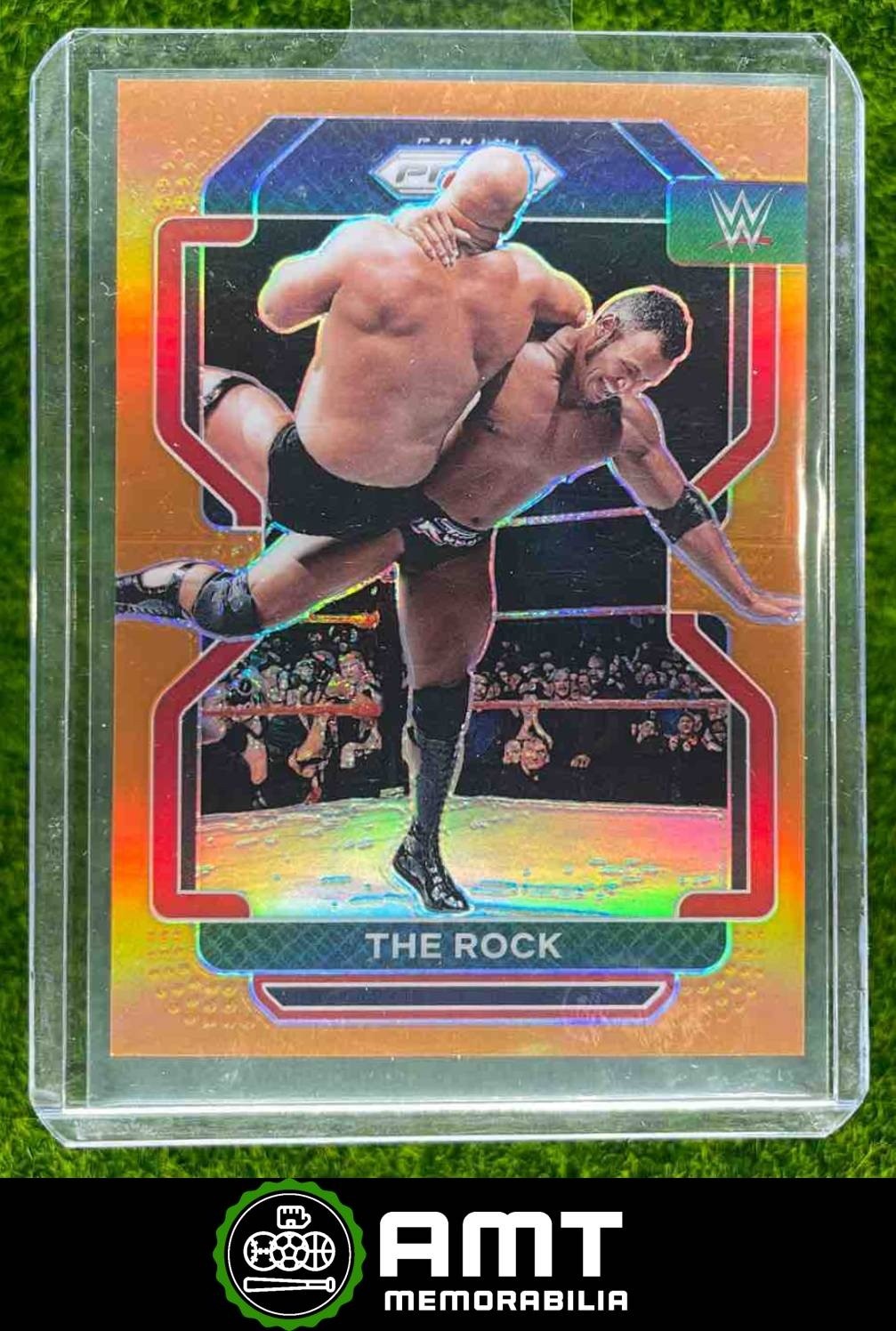 The Rock 2022 Panini Prizm WWE Orange 63/99 #191