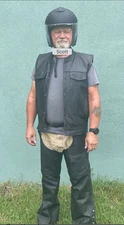 Motorcycle riding leather chaps and leather vest with concealed carry pocket