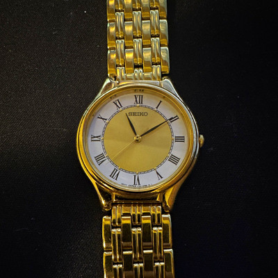 Seiko Quartz Gold Tone Roman Numeral Analog Dress Watch Metal Bracelet WR