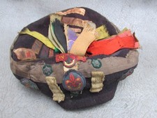 AN OLD BOYS SCOUT BERET ADORNED WITH PATCHES AND BADGES c1940