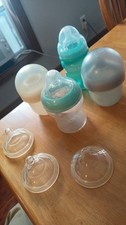 Set of 4 baby bottles, extra nipples, 2 nuby 2 boon infant 4 oz