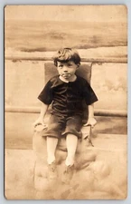 Postcard RPPC Boy Sitting with Beach Backdrop Real Photo