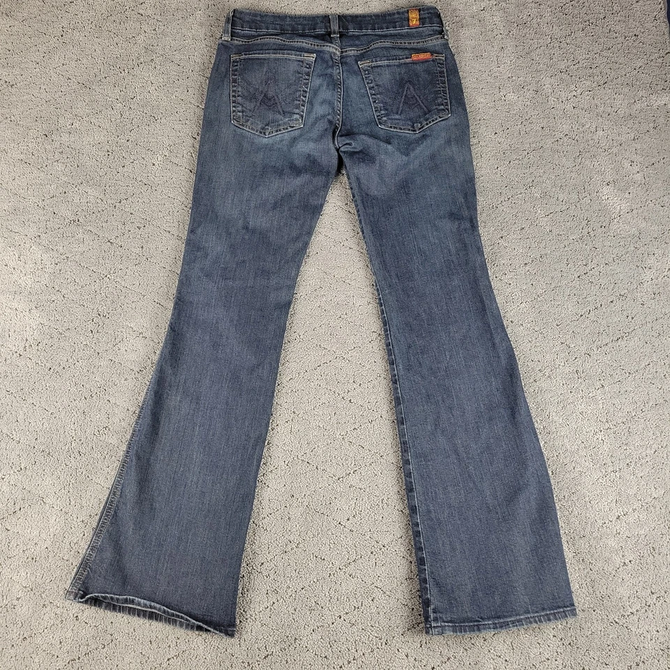 Pantalones de mezclilla para mujer 7 For All Mankind 27 azules con bolsillo tiro bajo acampanados lavado oscuro elásticos Foto 3 de 4