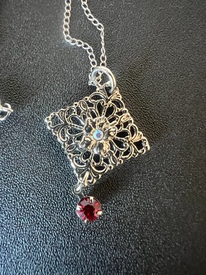 Marvel Sterling Silver Ornate Pendant with a Dangly Red Stone