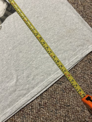 Yellow measuring tape on light gray VTG shirt, black cat design, text “You’re Mine!” Made in USA.