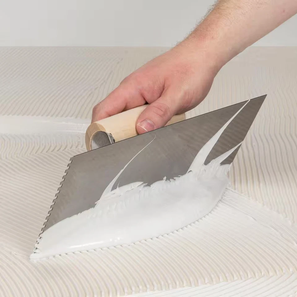 1/8 pulg. X 1/8 pulg. X 1/8 pulg. Paleta para pisos de madera Square Notch Pro con mano de madera Foto 2 de 4