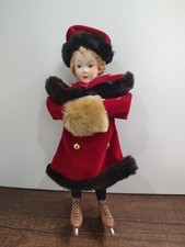 Vintage 7.5 inch porcelain doll with velvet dress and wearing ice skates A5