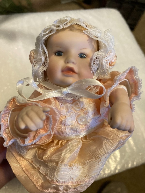 Small  Porcelain Baby Doll Laying on Her Stomach