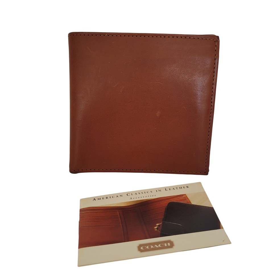 A genuine vintage Coach bifold in British Tan leather with a snap coin pocket — built in an era when Coach meant heirloom-quality American craftsmanship.