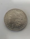 1884-O-Morgan $1 AU/UNC