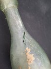 Antique Green Glass Torpedo Bottle With Stuff Inside — photo 4