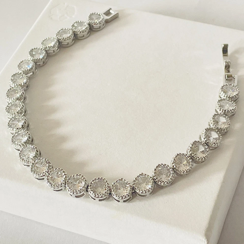 Pulsera de tenis estilo Swarovski plateada chapada en rodio para mujer joyería nupcial Reino Unido Foto 3 de 4