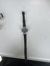 timex silver face black leather with white numbers stainless steel back