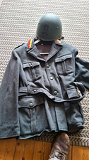 Italian WW2 repro tunic (40") and steel helmet (60). Original collar tabs.