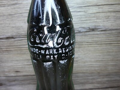 vintage Coca Cola bottle white lid w/ soda still capped 1945
