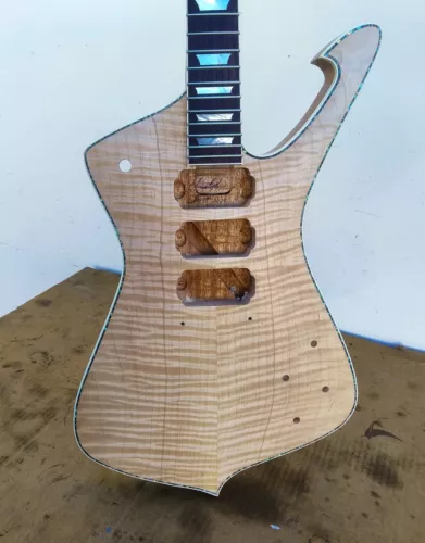 Iceman Guitar by Christopher Scott. Flamed maple to solid mahogany body and neck