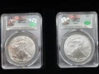 Lot of 2 - Silver Eagles CAC MS69 Type 1 and Type 2. CAC Green Label With Auto
