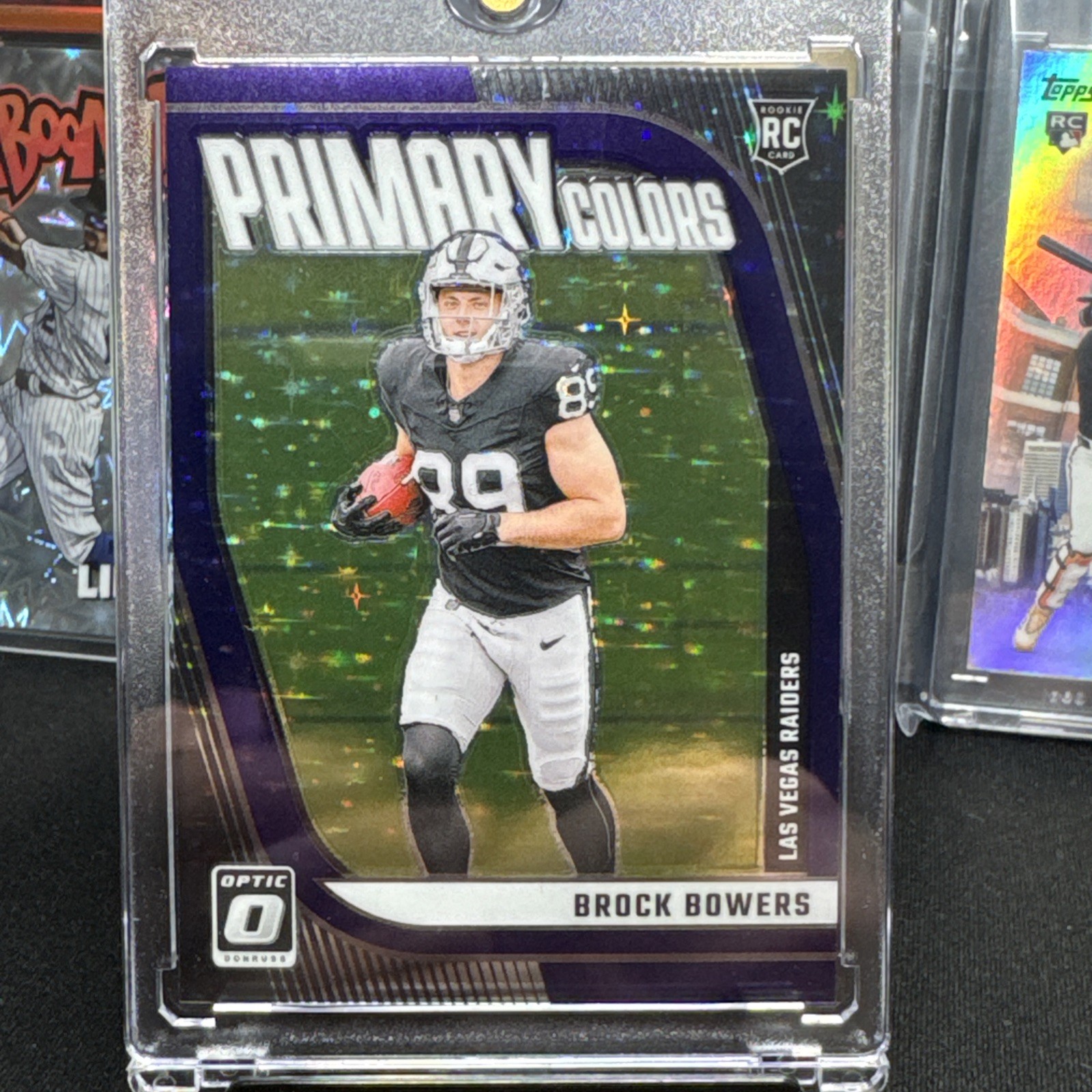 2024 Donruss Optic Primary Colors Brock Bowers #8 Purple Stars Prizm /25 (RC)