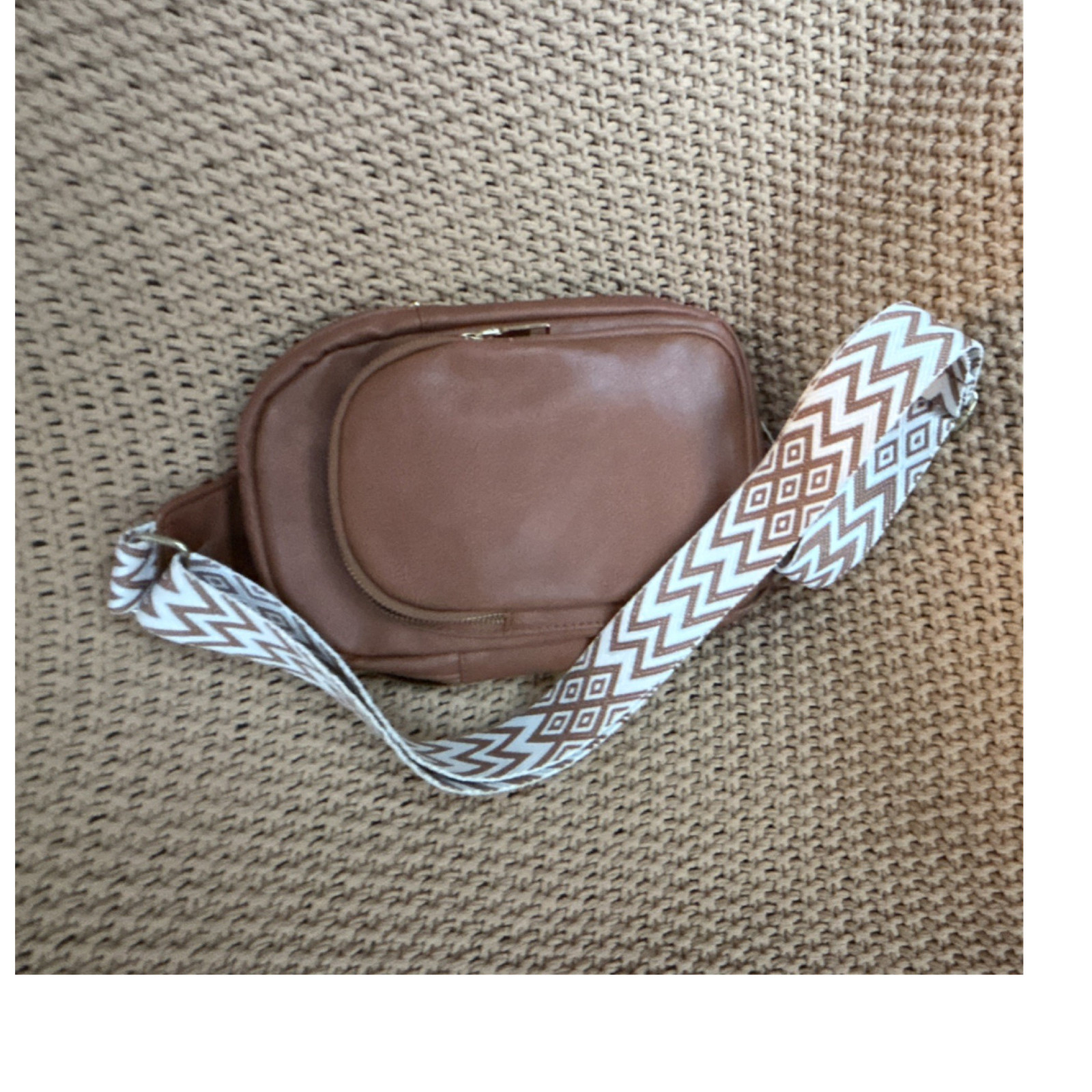 Brown Crossbody Bag with Zipper Closure and Patterned Strap