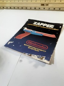 Nintendo NES Zapper Instruction Manual Booklet Only Has Some Damage On Cover.   